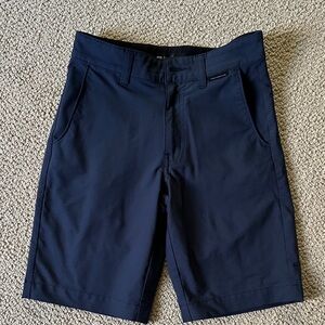 Boys Travis Mathew golf shorts.